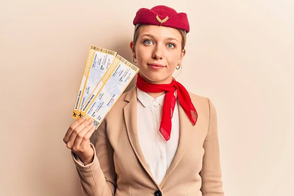 Young Beautiful Blonde Girl Wearing Stewardess Uniform Holding Boarding Pass — Stock Photo, Image