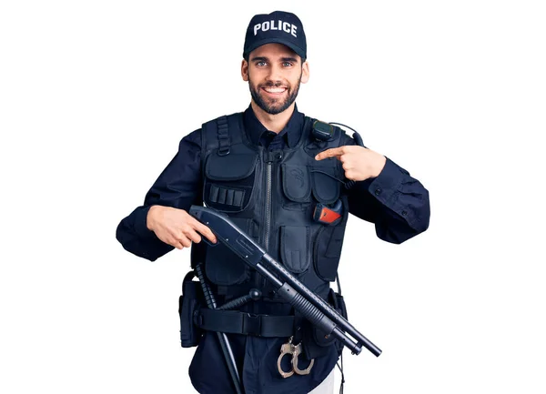 Young Handsome Man Beard Wearing Police Uniform Holding Shotgun Pointing — Stock Photo, Image