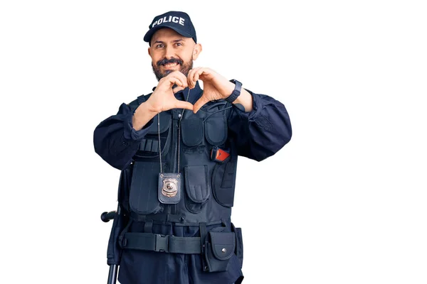 Jonge Knappe Man Politie Uniform Lachend Liefde Hartsymbool Met Handen — Stockfoto