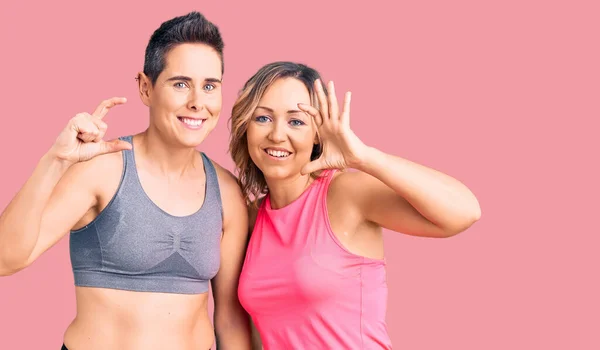 Couple Women Wearing Sportswear Smiling Confident Gesturing Hand Doing Small — Stock Photo, Image