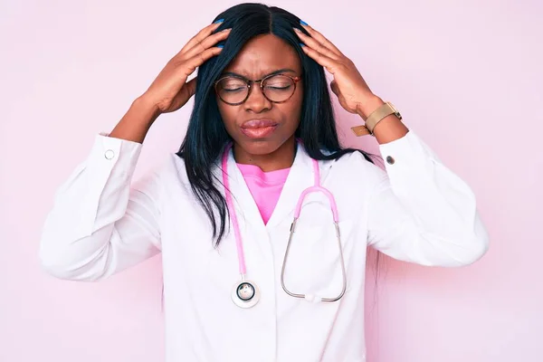 Young African American Woman Wearing Doctor Stethoscope Suffering Headache Desperate — Stock Photo, Image