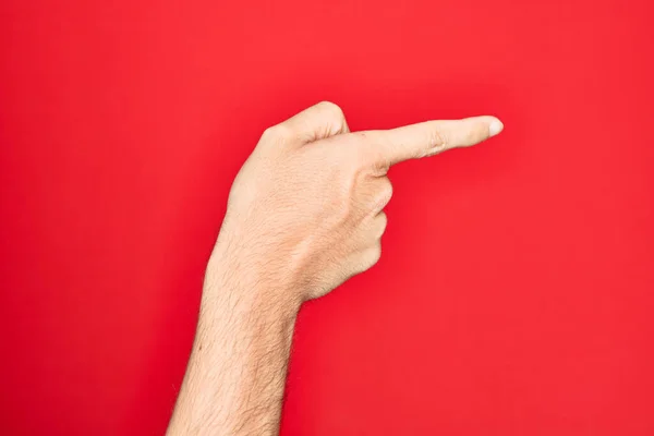 Hand Caucasian Young Man Showing Fingers Isolated Red Background Pointing — Stock Photo, Image