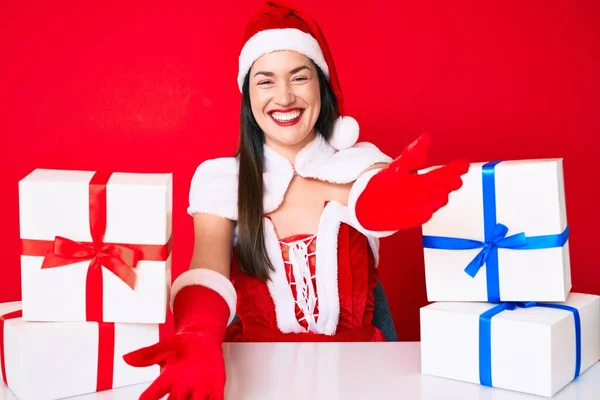 Young Woman Wearing Santa Claus Costume Sitting Desk Gifts Looking — Stock Photo, Image