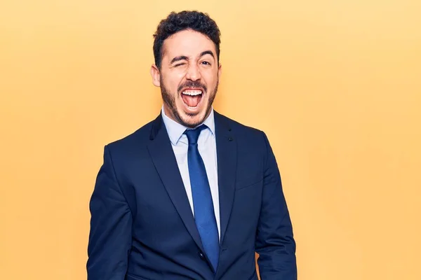 Young Hispanic Man Wearing Suit Winking Looking Camera Sexy Expression — Stock Photo, Image