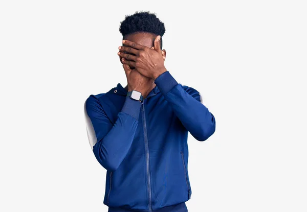 Young African American Man Wearing Sportswear Covering Eyes Mouth Hands — Stock Photo, Image