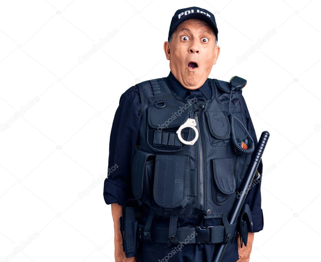 Senior handsome man wearing police uniform scared and amazed with open mouth for surprise, disbelief face 