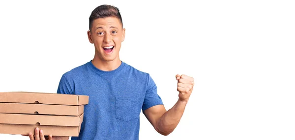 Young Handsome Hispanic Man Holding Delivery Pizza Box Screaming Proud — Stock Photo, Image