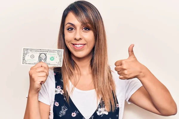 Mladá Krásná Žena Drží Jeden Dolar Úsměvem Šťastný Pozitivní Palec — Stock fotografie