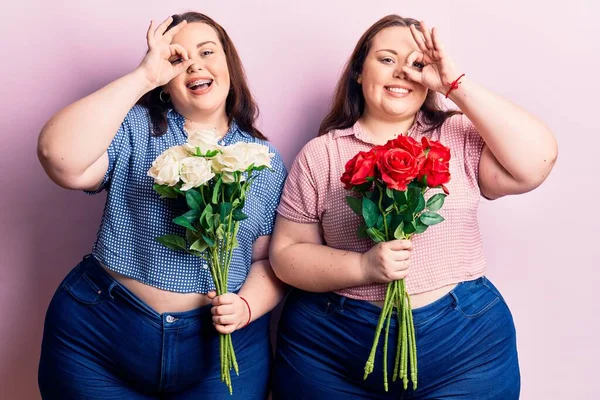 Young Size Twins Holding Flowers Smiling Happy Doing Sign Hand — Stock Photo, Image