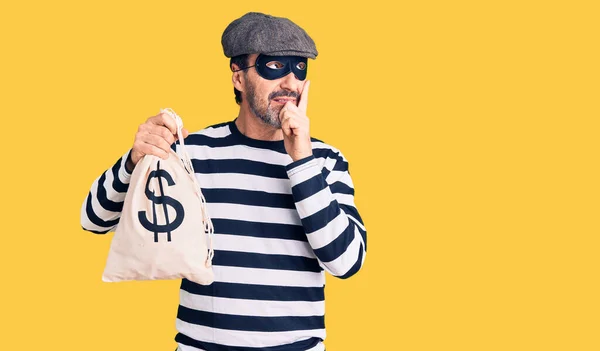 Middle Age Handsome Man Wearing Burglar Mask Holding Money Bag — Stock Photo, Image