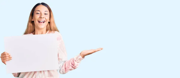 Beautiful Young Woman Holding Blank Empty Banner Celebrating Victory Happy — Stock Photo, Image