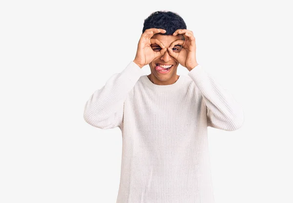 Young African Amercian Man Wearing Casual Clothes Doing Gesture Binoculars — Stock Photo, Image