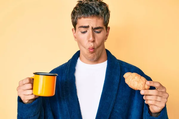 Young Handsome Man Wearing Bathrobe Eating Breakfast Holding Coffee Croissant — Stock Photo, Image