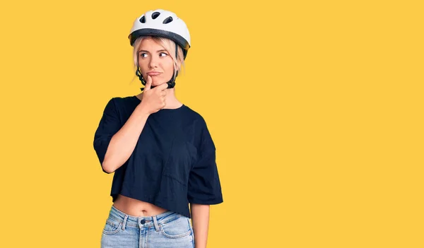 Young Beautiful Blonde Woman Wearing Bike Helmet Serious Face Thinking — Stock Photo, Image
