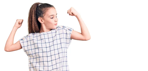 Cute Hispanic Child Girl Wearing Casual Clothes Showing Arms Muscles — Stock Photo, Image