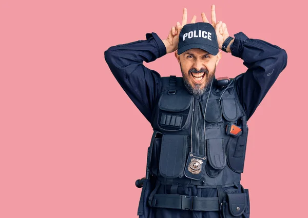 Young Handsome Man Wearing Police Uniform Posing Funny Crazy Fingers — Stock Photo, Image