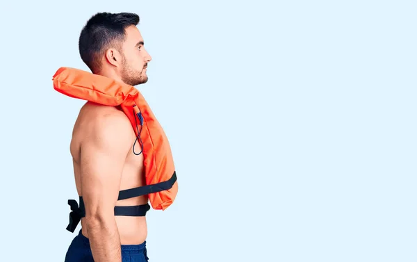 Young Handsome Man Wearing Lifejacket Looking Side Relax Profile Pose — Stock Photo, Image