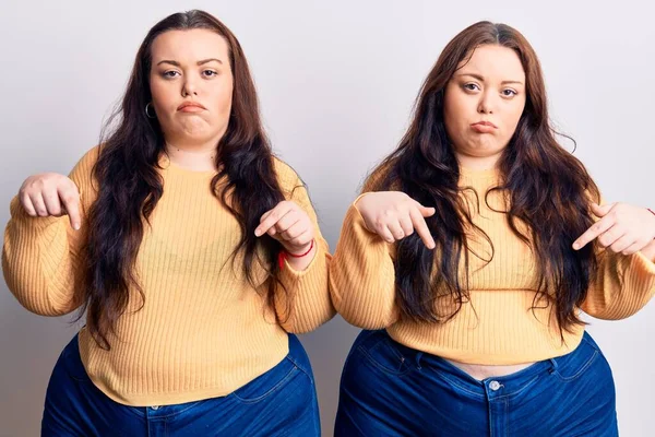 Young Size Twins Wearing Casual Clothes Pointing Looking Sad Upset — Stock Photo, Image