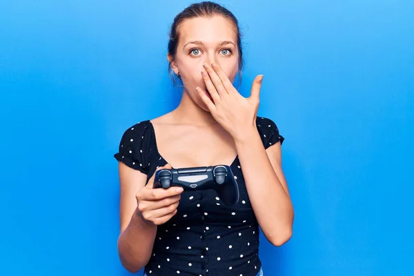 Young Blonde Woman Playing Video Game Holding Controller Covering Mouth — Stock Photo, Image