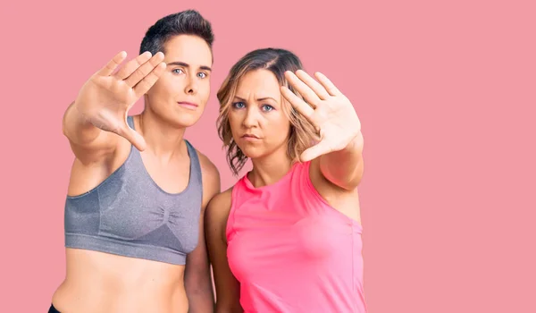 Couple Women Wearing Sportswear Doing Frame Using Hands Palms Fingers — Stock Photo, Image