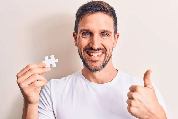 Young Handsome Man Holding Piece Puzzle Standing Isolated White Background — Stock Photo, Image