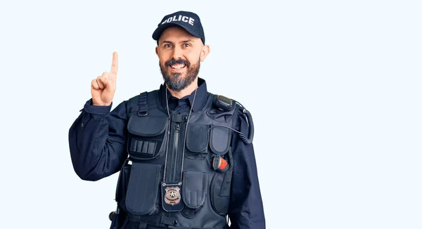 Young Handsome Man Wearing Police Uniform Pointing Finger Successful Idea — Stock Photo, Image