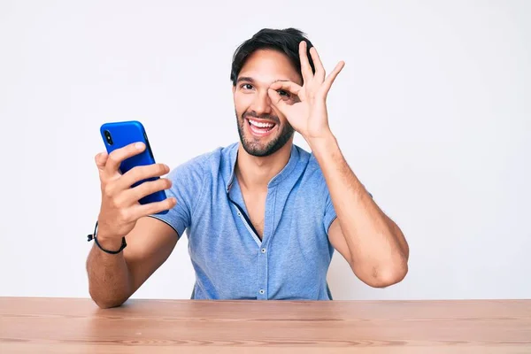 Handsome Hispanic Man Using Smartphone Sitting Table Smiling Happy Doing — Stock Photo, Image