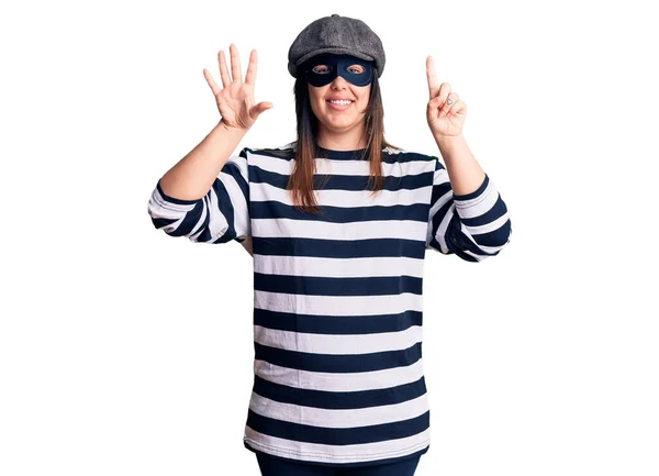 Young Beautiful Brunette Woman Wearing Burglar Mask Showing Pointing Fingers — Stock Photo, Image