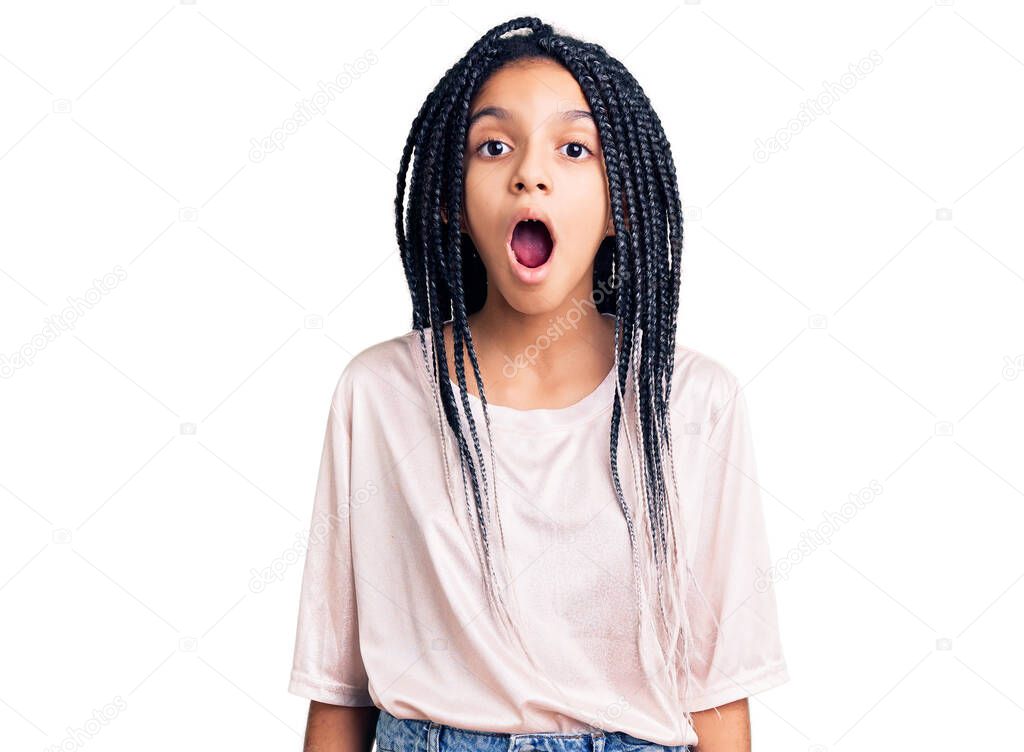 Cute african american girl wearing casual clothes scared and amazed with open mouth for surprise, disbelief face 