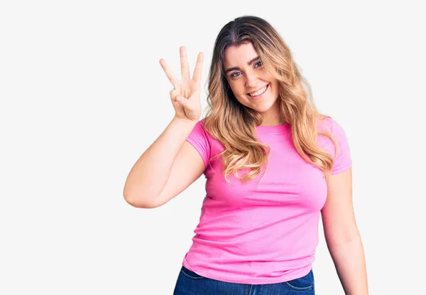 Young Caucasian Woman Wearing Sportswear Showing Pointing Fingers Number Three — Stock Photo, Image