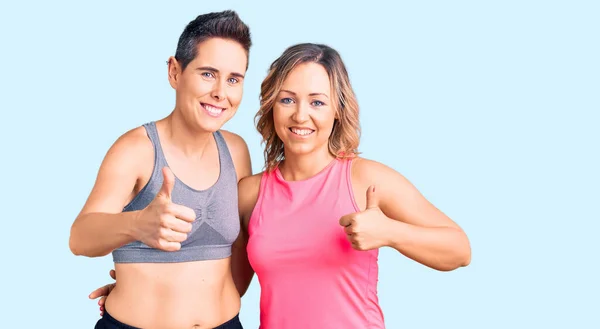 Couple Women Wearing Sportswear Success Sign Doing Positive Gesture Hand — Stock Photo, Image