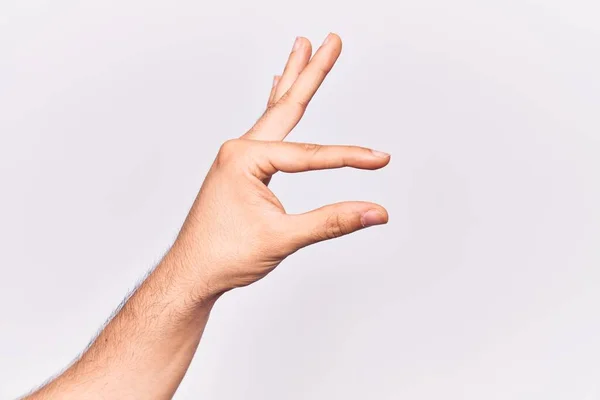 Close Mão Jovem Caucasiano Sobre Fundo Isolado Pegar Tomar Coisa — Fotografia de Stock