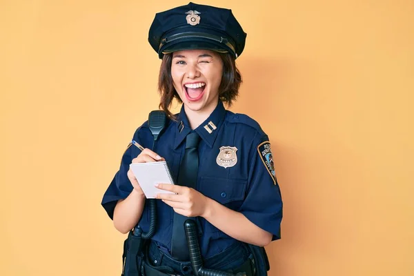 Young Beautiful Girl Wearing Police Uniform Writing Traffic Fine Winking — Stock Photo, Image
