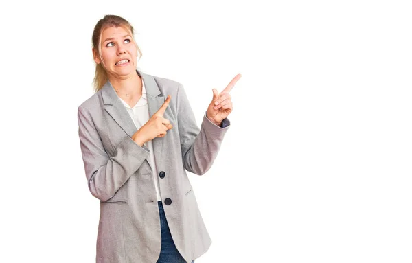 Young Beautiful Blonde Woman Wearing Elegant Jacket Pointing Aside Worried — Stock Photo, Image