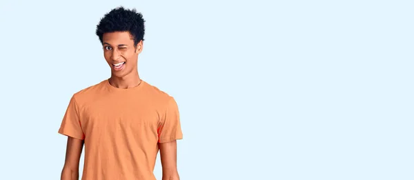 Young African American Man Wearing Casual Clothes Winking Looking Camera — Stock Photo, Image