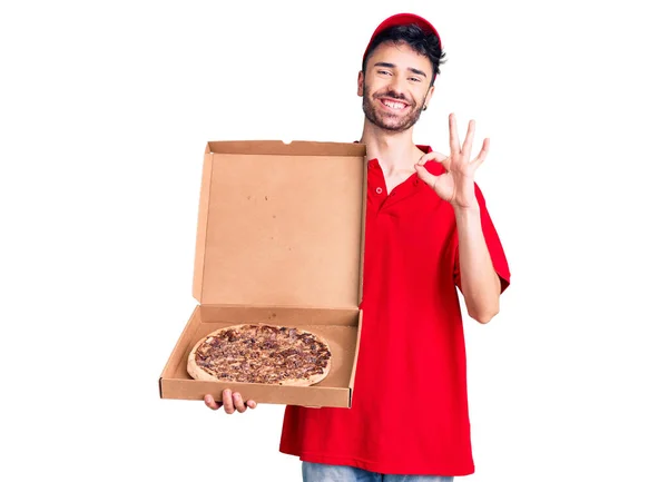 Young Hispanic Man Holding Delivery Pizza Box Doing Sign Fingers — Stock Photo, Image