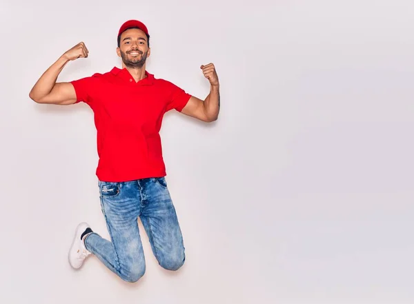 Young Handsome Hispanic Deliveryman Wearing Uniform Smiling Happy Jumping Smile — Stock Photo, Image