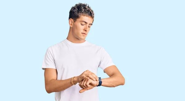 Young Handsome Man Wearing Casual White Tshirt Checking Time Wrist — Stock Photo, Image