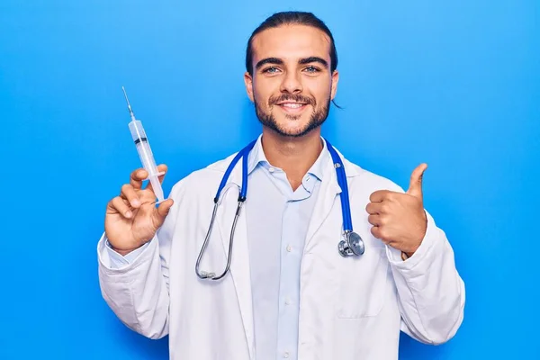 Young Handsome Man Wearing Doctor Stethoscope Holding Syringe Smiling Happy — Stock Photo, Image