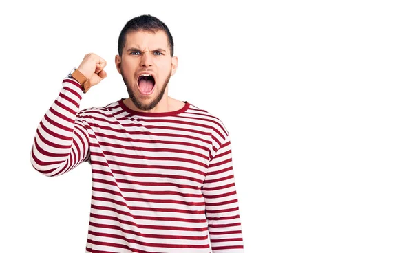 Young Handsome Man Wearing Striped Sweater Angry Mad Raising Fist — Stock Photo, Image