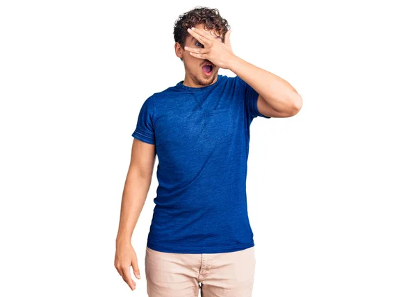 Young Handsome Man Curly Hair Wearing Casual Clothes Peeking Shock — Stock Photo, Image