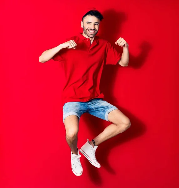 Young Handsome Deliveryman Wearing Cap Smiling Happy Jumping Smile Face — Stock Photo, Image