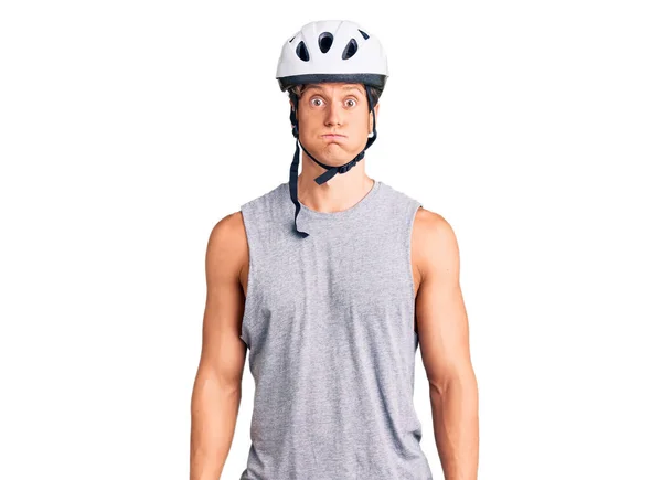 Young Handsome Man Wearing Bike Helmet Puffing Cheeks Funny Face — Stock Photo, Image