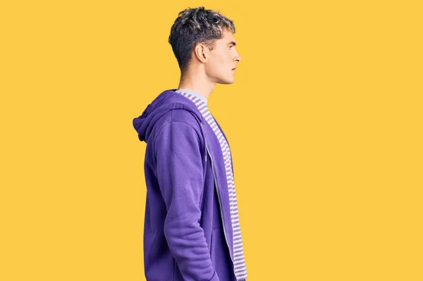 Young Handsome Man Wearing Casual Purple Sweatshirt Looking Side Relax — Stock Photo, Image