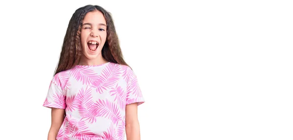 Cute hispanic child girl wearing casual clothes winking looking at the camera with sexy expression, cheerful and happy face. — Stock Image Cute Hispanic Child Girl Wearing Casual Clothes Winking Looking Camera Royalty Free Stock Images