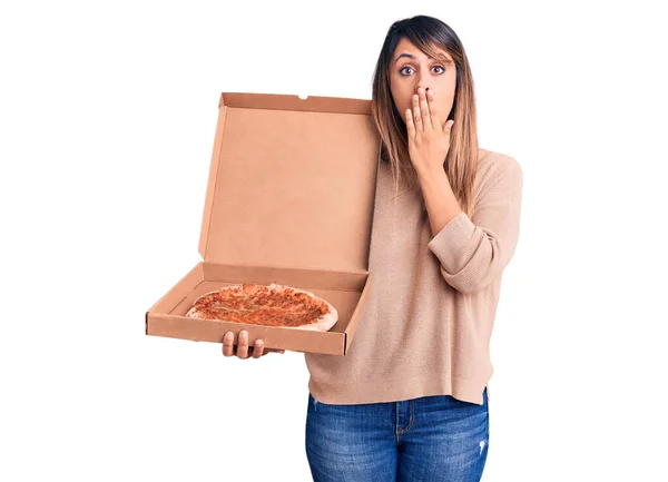 Young Beautiful Woman Holding Delivery Cardboard Box Pizza Covering Mouth — Stock Photo, Image