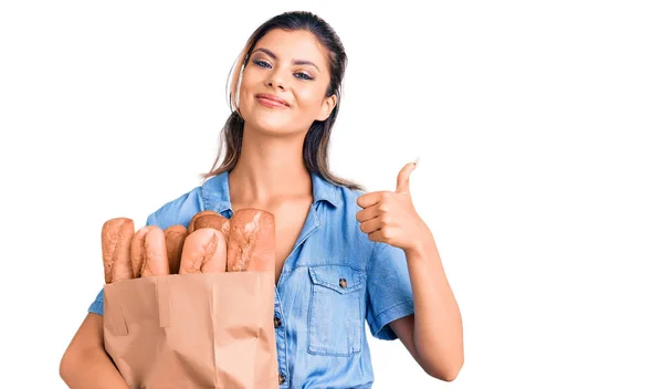 Young Beautiful Woman Holding Paper Bag Bread Smiling Happy Positive — Stock Photo, Image