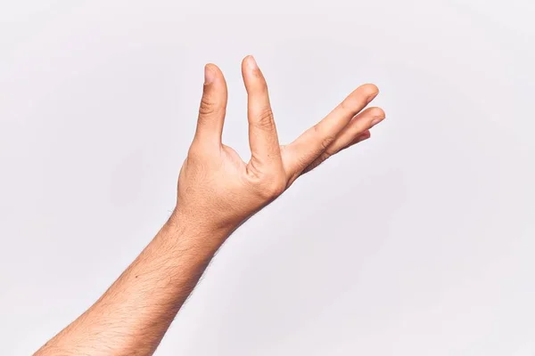 Close Mão Jovem Caucasiano Sobre Fundo Isolado Pegar Tomar Coisa — Fotografia de Stock