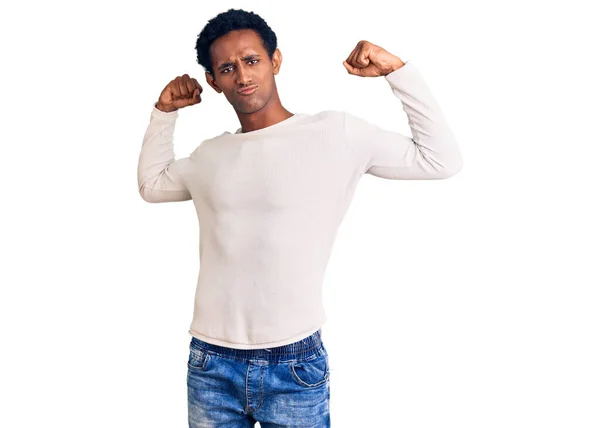 African Handsome Man Wearing Casual Winter Sweater Showing Arms Muscles — Stock Photo, Image