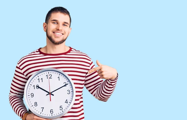 Young Handsome Man Holding Big Clock Pointing Finger One Self — Stock Photo, Image